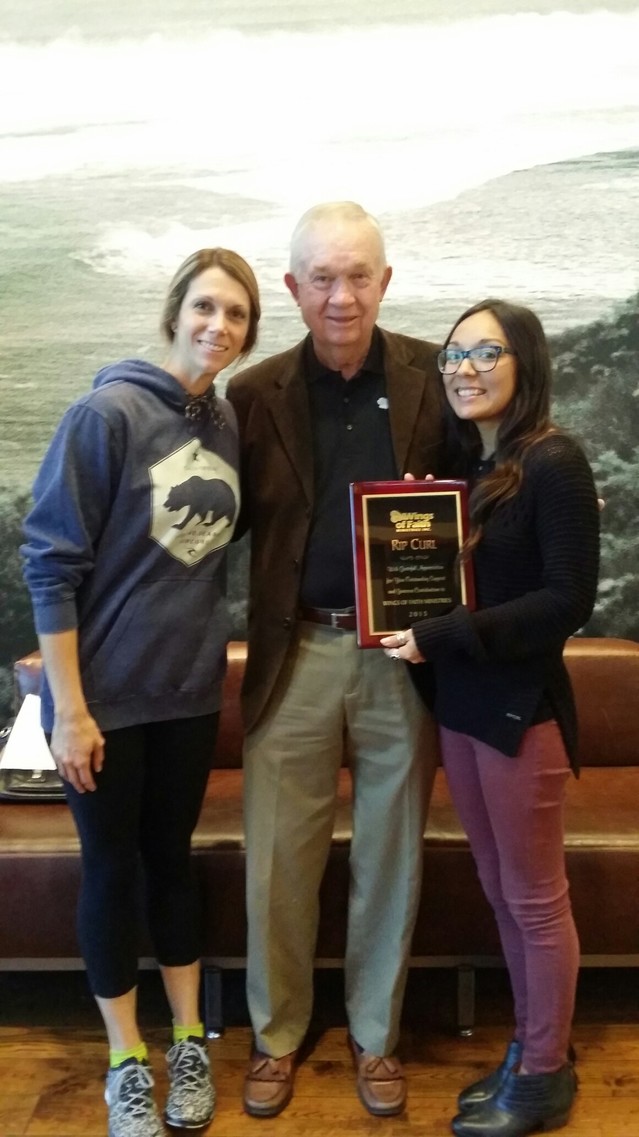 Becca Davis, V.P. of Retail, Rip Curl, and Danika Zamarron, Buyer,  received a plaque of appreciation from Wings of Faith